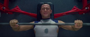 Movie still from “Don Jon” (2013), directed by Joseph Gordon-Levitt – A man is lifting a barbell in a gym; Close Up shot, Overhead angle