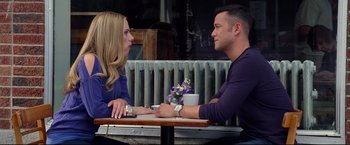 Movie still from “Don Jon” (2013), directed by Joseph Gordon-Levitt – A man and a woman sitting at a table talking to each other; Medium shot, Over the shoulder angle