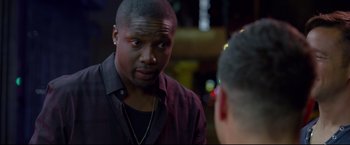 Movie still from “Don Jon” (2013), directed by Joseph Gordon-Levitt – A man in a black shirt talking to another man in a black shirt; Close Up shot, Over the shoulder angle