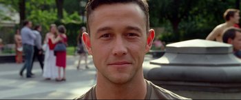 Movie still from “Don Jon” (2013), directed by Joseph Gordon-Levitt – A young man's face in front of some trees; Close Up shot, Over the shoulder angle