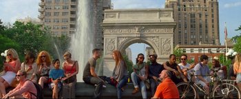 Movie still from “Don Jon” (2013), directed by Joseph Gordon-Levitt – A group of people sitting on top of a stone wall; Wide shot, High angle