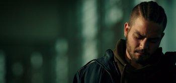 Movie still from “Don't Breathe” (2016), directed by Fede Alvarez – A person wearing a black jacket; Close Up shot, Low angle