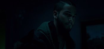 Movie still from “Don't Breathe” (2016), directed by Fede Alvarez – A man with a beard is looking at the camera; Close Up shot, Over the shoulder angle