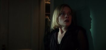 Movie still from “Don't Breathe” (2016), directed by Fede Alvarez – A young woman is looking up at the ceiling; Close Up shot, Low angle