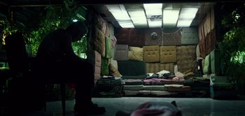 Movie still from “Don't Breathe” (2016), directed by Fede Alvarez – A room filled with lots of different colored pillows; Wide shot, Overhead angle