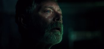 Movie still from “Don't Breathe” (2016), directed by Fede Alvarez – A person with a beard; Close Up shot, Low angle
