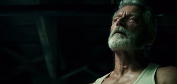 Movie still from “Don't Breathe” (2016), directed by Fede Alvarez – An old man with a beard and a white mustache; Close Up shot, Low angle