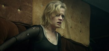 Movie still from “Don't Breathe” (2016), directed by Fede Alvarez – A woman with a black shirt is looking to her left; Close Up shot, Low angle
