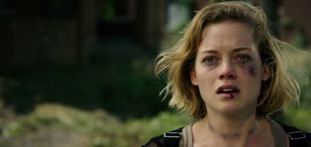 Movie still from “Don't Breathe” (2016), directed by Fede Alvarez – A person with her hair blowing in the wind; Close Up shot, Over the shoulder angle