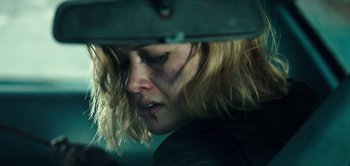 Movie still from “Don't Breathe” (2016), directed by Fede Alvarez – A person in a car; Close Up shot, Over the shoulder angle