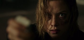Movie still from “Don't Breathe” (2016), directed by Fede Alvarez – A woman's face in the dark; Close Up shot, Low angle