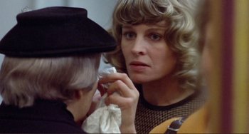 Movie still from “Don't Look Now” (1973), directed by Nicolas Roeg – An older woman looking at another older woman's face; Close Up shot, Over the shoulder angle