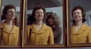 Movie still from “Don't Look Now” (1973), directed by Nicolas Roeg – Two women looking at each other in a mirror; Close Up shot, Low angle