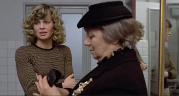 Movie still from “Don't Look Now” (1973), directed by Nicolas Roeg – Two women are standing in front of each other; Close Up shot, Over the shoulder angle