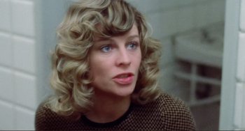 Movie still from “Don't Look Now” (1973), directed by Nicolas Roeg – A person with curly hair; Close Up shot, Over the shoulder angle