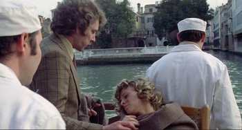 Movie still from “Don't Look Now” (1973), directed by Nicolas Roeg – A man and a woman on a boat in the water; Medium shot, High angle