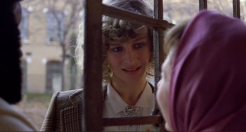 Movie still from “Don't Look Now” (1973), directed by Nicolas Roeg – A woman looking at her reflection in a mirror; Close Up shot, Over the shoulder angle
