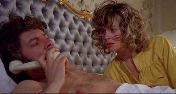 Movie still from “Don't Look Now” (1973), directed by Nicolas Roeg – A man and a woman are sitting on a bed together; Close Up shot, Low angle