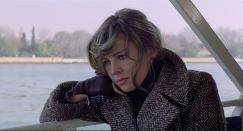 Movie still from “Don't Look Now” (1973), directed by Nicolas Roeg – A woman leaning on a railing near a body of water; Close Up shot, Low angle