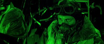 Movie still from “La Grande Vadrouille” (1966), directed by Gérard Oury – A man in a helmet and goggles in the dark; Close Up shot, Low angle