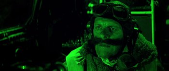 Movie still from “La Grande Vadrouille” (1966), directed by Gérard Oury – A man with a mustache wearing a pilot's hat; Close Up shot, Low angle