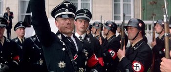Movie still from “La Grande Vadrouille” (1966), directed by Gérard Oury – A group of men in nazi garb standing next to each other; Medium shot, Low angle