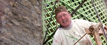 Movie still from “La Grande Vadrouille” (1966), directed by Gérard Oury – An old man with a bandana on his head; Medium shot, Low angle