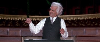 Movie still from “La Grande Vadrouille” (1966), directed by Gérard Oury – An older man wearing a white shirt and a tie; Medium shot, High angle