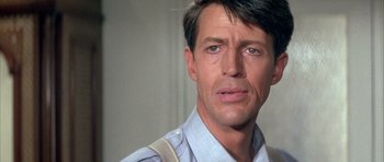 Movie still from “La Grande Vadrouille” (1966), directed by Gérard Oury – A person wearing a shirt and tie; Close Up shot, Low angle