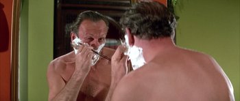 Movie still from “La Grande Vadrouille” (1966), directed by Gérard Oury – A man shaving his face in front of a mirror; Close Up shot, Over the shoulder angle