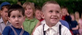Movie still from “La Grande Vadrouille” (1966), directed by Gérard Oury – A group of children standing next to each other; Close Up shot, Low angle