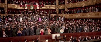 Movie still from “La Grande Vadrouille” (1966), directed by Gérard Oury – A large crowd of people standing in front of an audience; Extreme Wide shot, High angle