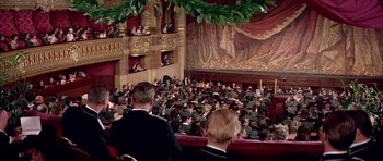 Movie still from “La Grande Vadrouille” (1966), directed by Gérard Oury – A crowd of people sitting in a large auditorium; Extreme Wide shot, High angle