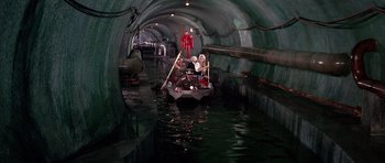 Movie still from “La Grande Vadrouille” (1966), directed by Gérard Oury – A group of people riding a boat down a river; Wide shot, High angle
