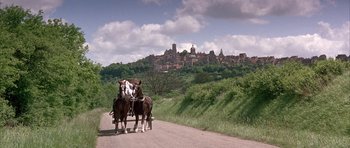 Movie still from “La Grande Vadrouille” (1966), directed by Gérard Oury – A couple of horses that are standing in the dirt; Extreme Wide shot, Low angle