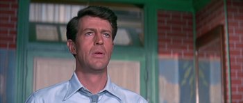 Movie still from “La Grande Vadrouille” (1966), directed by Gérard Oury – A person wearing a shirt and a tie; Close Up shot, Low angle