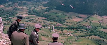 Movie still from “La Grande Vadrouille” (1966), directed by Gérard Oury – Two men in uniforms looking out over a valley; Extreme Wide shot, High angle