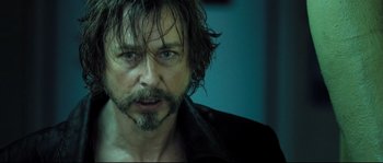 Movie still from “Doomsday” (2008), directed by Neil Marshall – A person with a beard; Close Up shot, Low angle