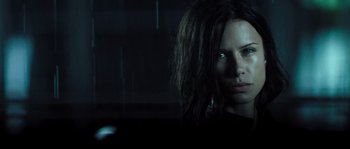 Movie still from “Doomsday” (2008), directed by Neil Marshall – A person with long dark hair; Close Up shot, Low angle