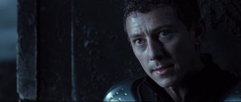 Movie still from “Doomsday” (2008), directed by Neil Marshall – A person wearing a helmet; Close Up shot, Over the shoulder angle