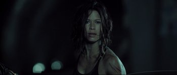 Movie still from “Doomsday” (2008), directed by Neil Marshall – A person wearing a tank top; Close Up shot, Low angle