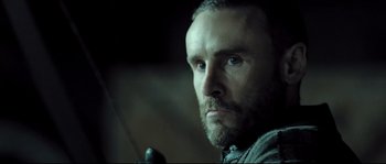 Movie still from “Doomsday” (2008), directed by Neil Marshall – A person with a sword; Close Up shot, Low angle