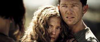 Movie still from “Doomsday” (2008), directed by Neil Marshall – A man and a woman embracing each other; Close Up shot, Low angle