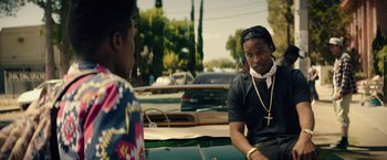 Movie still from “Dope” (2015), directed by Rick Famuyiwa – Two young men sitting on a boat in the water; Medium shot, Over the shoulder angle