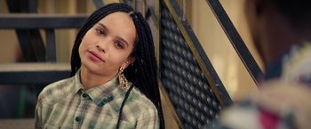 Movie still from “Dope” (2015), directed by Rick Famuyiwa – A woman with long braids wearing a plaid shirt; Close Up shot, High angle