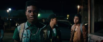 Movie still from “Dope” (2015), directed by Rick Famuyiwa – A group of young men standing next to each other on the street; Close Up shot, Low angle
