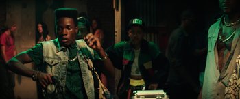 Movie still from “Dope” (2015), directed by Rick Famuyiwa – Two young men are dancing in a dark room; Medium shot, Over the shoulder angle