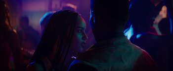 Movie still from “Dope” (2015), directed by Rick Famuyiwa – A man and a woman are standing in a dark room; Close Up shot, Over the shoulder angle