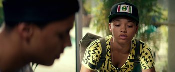 Movie still from “Dope” (2015), directed by Rick Famuyiwa – A young man sitting on top of a bench; Close Up shot, Over the shoulder angle
