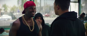 Movie still from “Dope” (2015), directed by Rick Famuyiwa – A group of young men standing next to each other; Medium shot, Over the shoulder angle